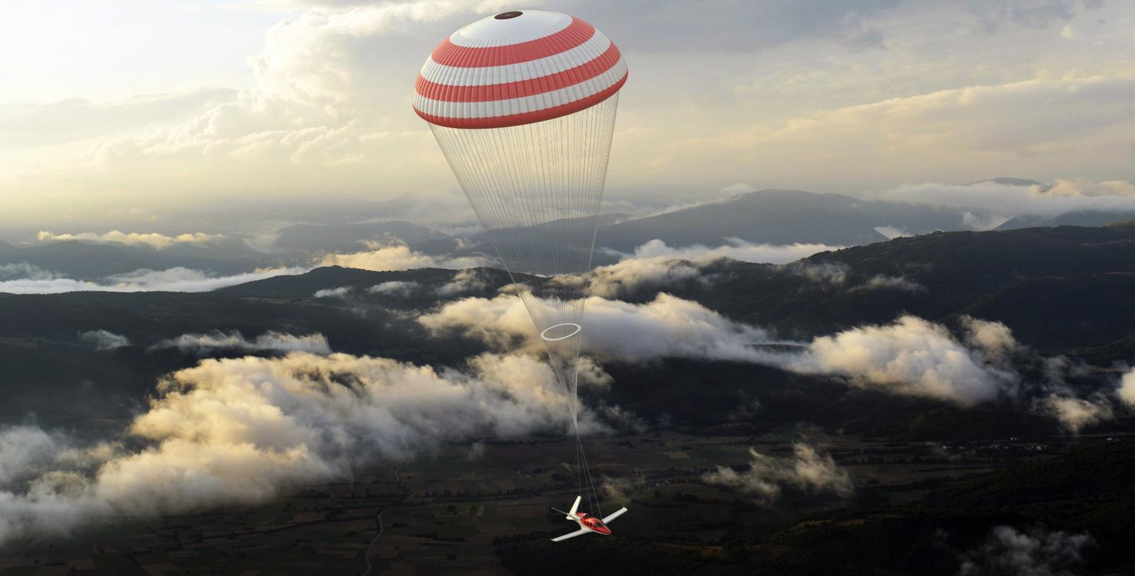 Cirrus Vision Jet descending under its airframe parachute